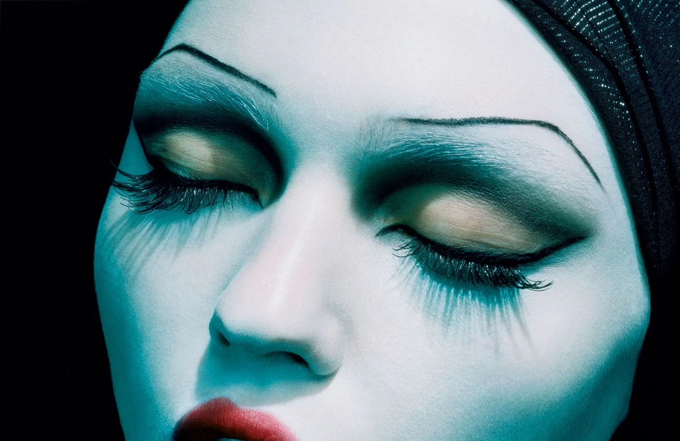 Extreme close-up of a woman's face with her eyes closed, L’Ange Noir by Miles Aldridge