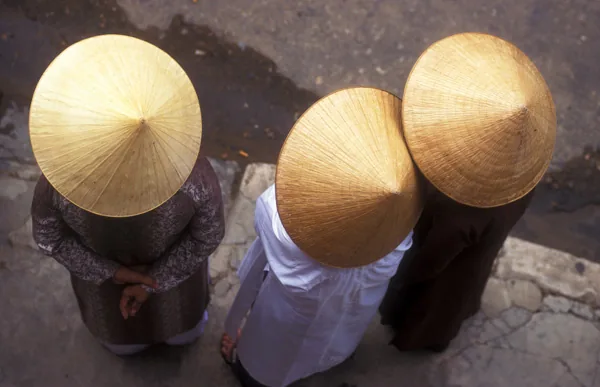 Vietnamese women photographed from a balcony.