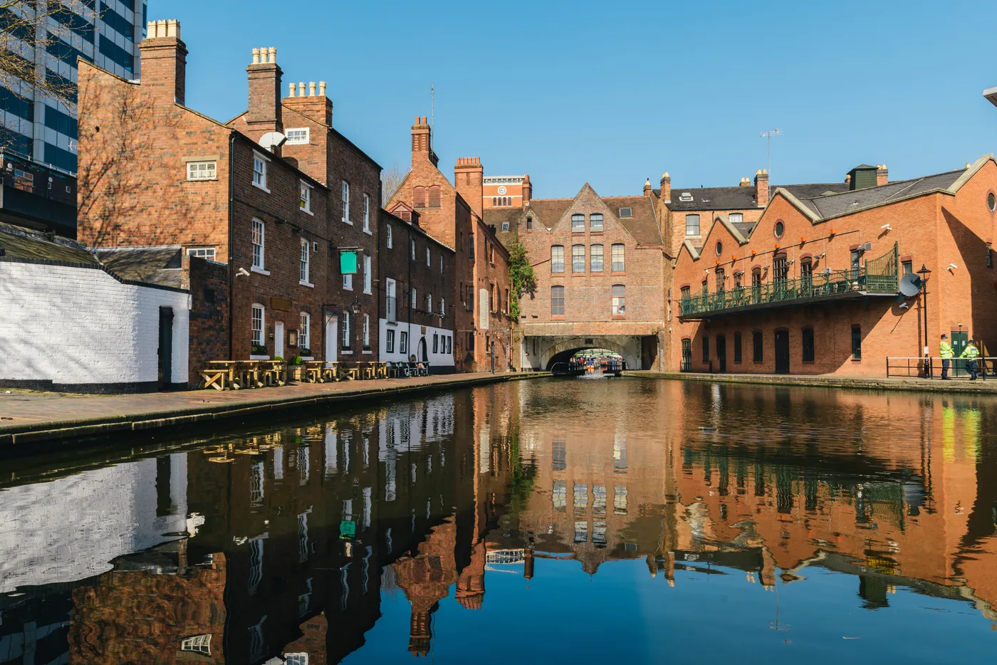 Brick buildings reflected in the canal at Gas Street Basin in Birmingham