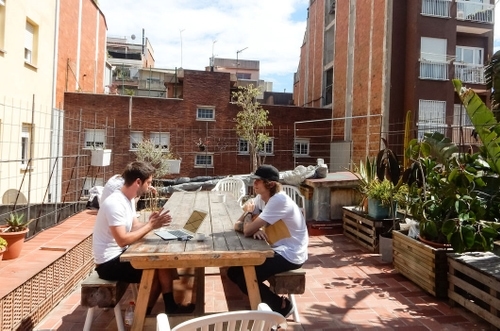 members chilling at the open rooftop of betahaus barcelona coworking space