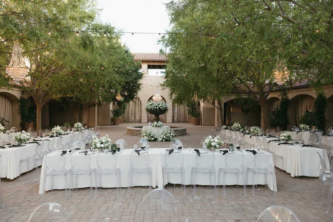 Modern black, white, and green outdoor wedding reception.