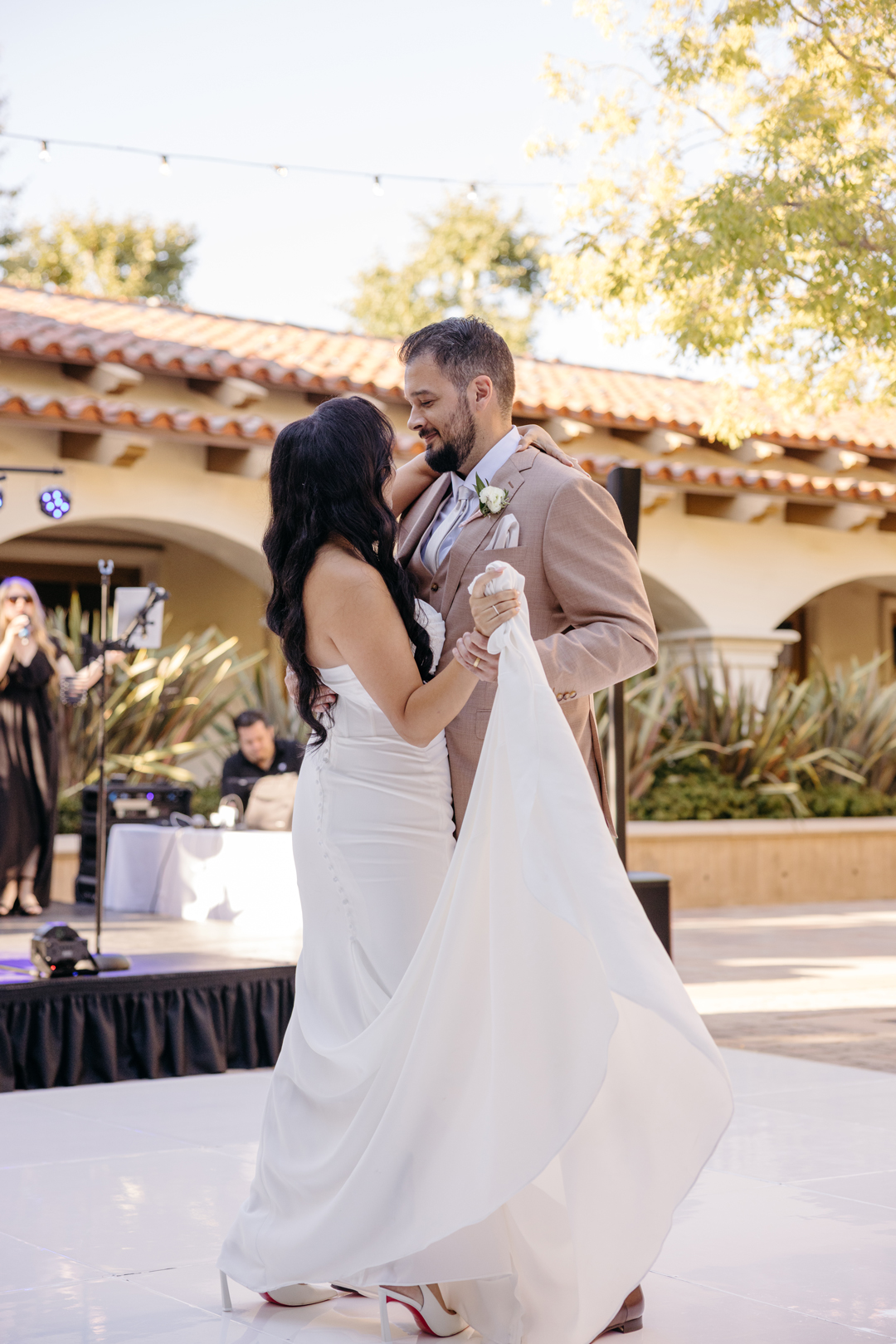 Bride and groom share first dance.