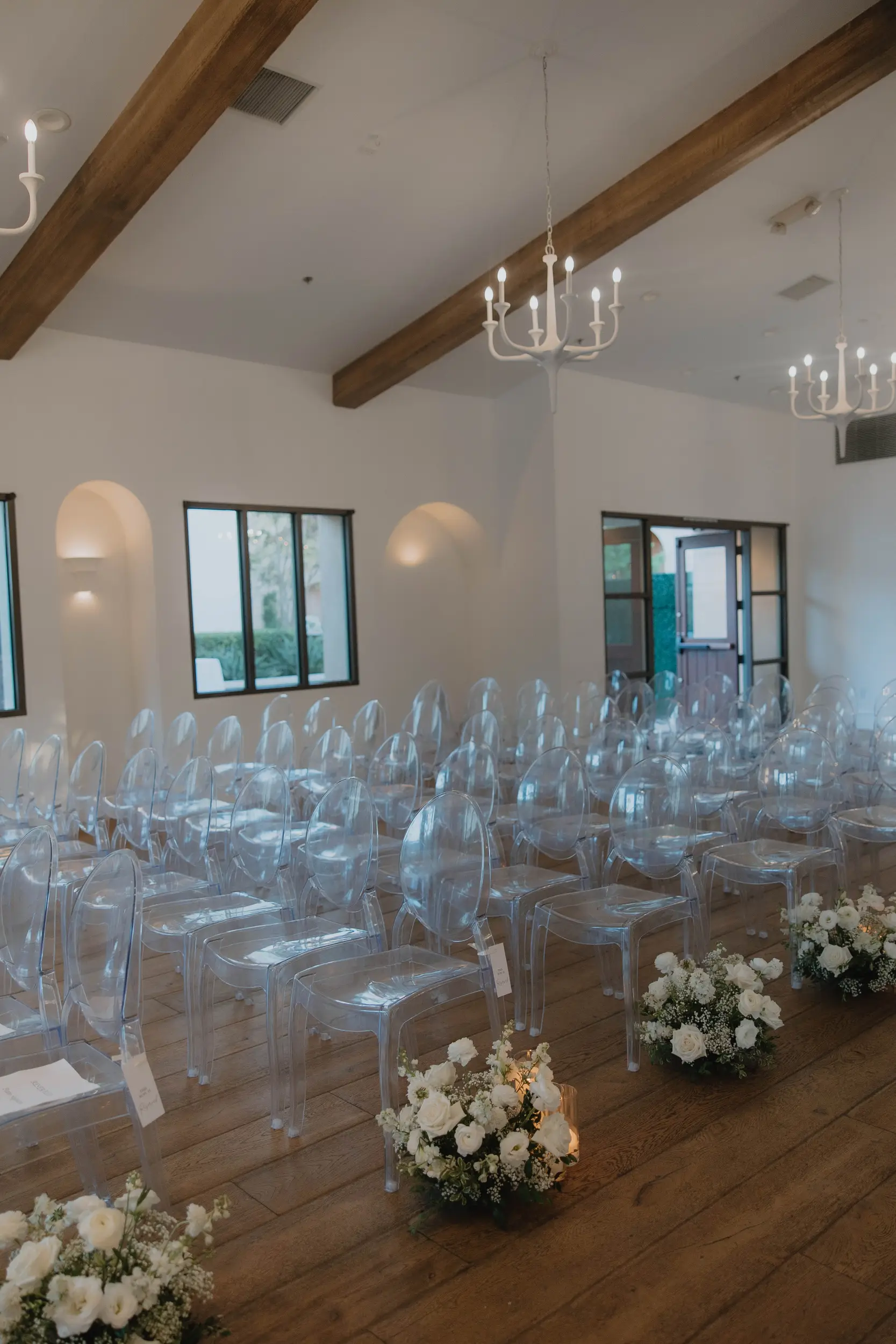 White flowers decorate the Lounge for an indoor wedding ceremony in San Juan Capistrano.