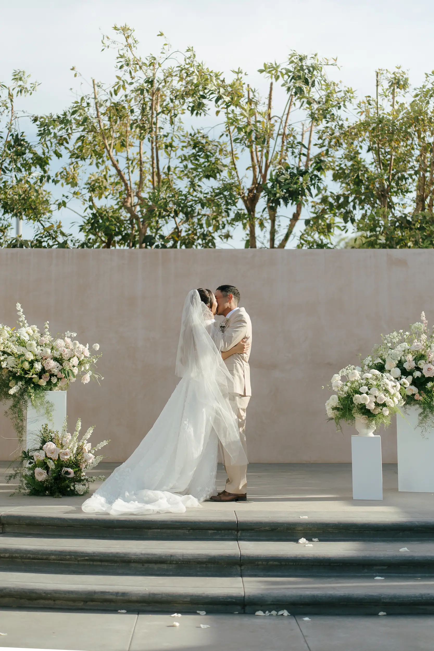 Bride and groom share a kiss to seal their ceremony.