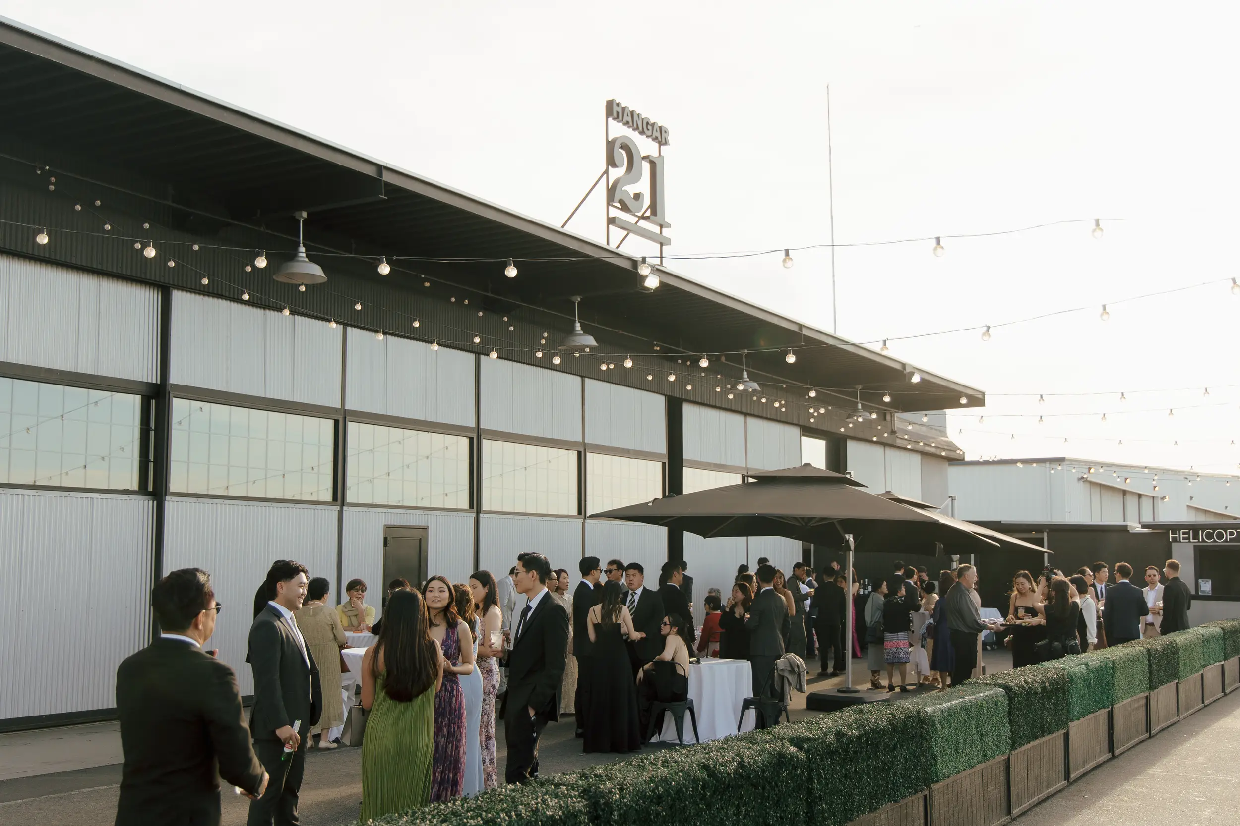 Guests mingle on the tarmac during cocktail hour.