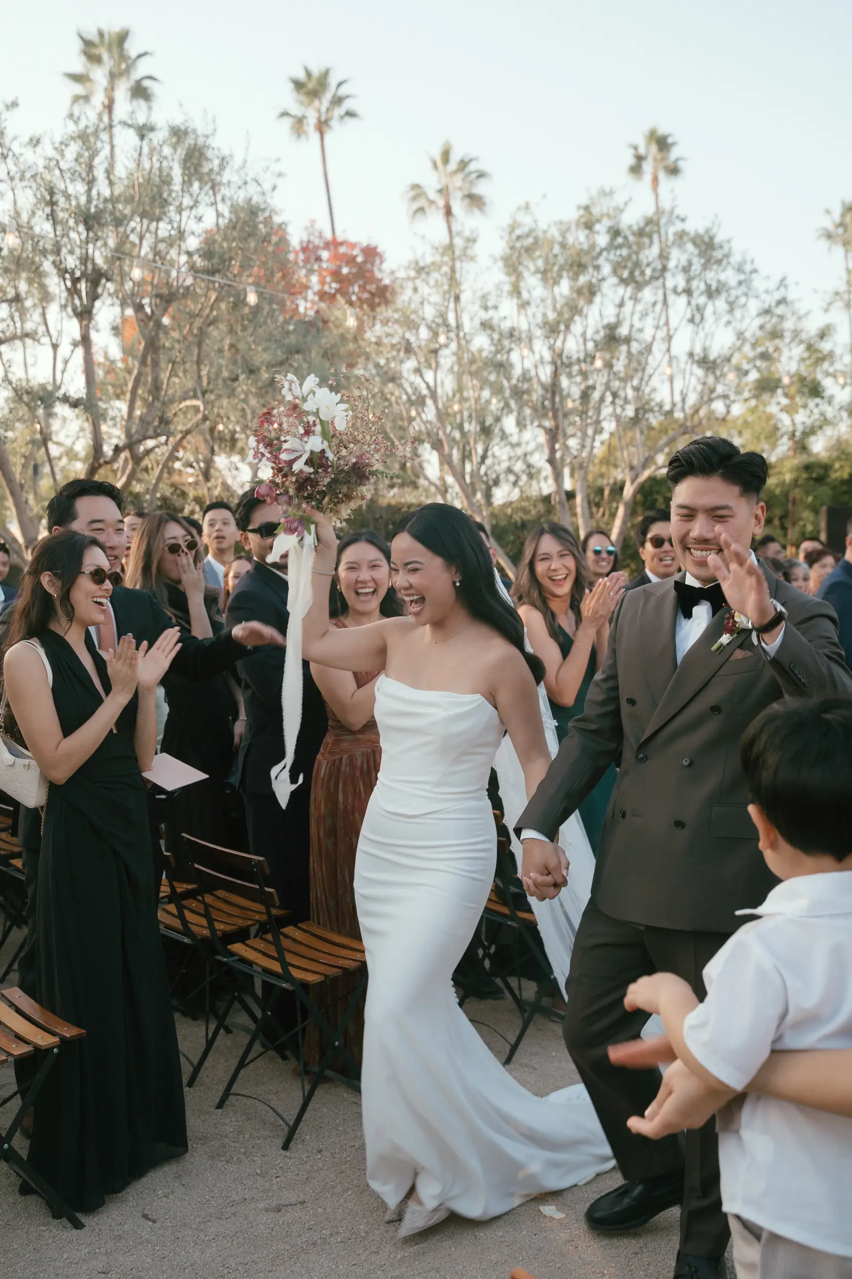 Bride and groom dance their way out of their wedding ceremony.