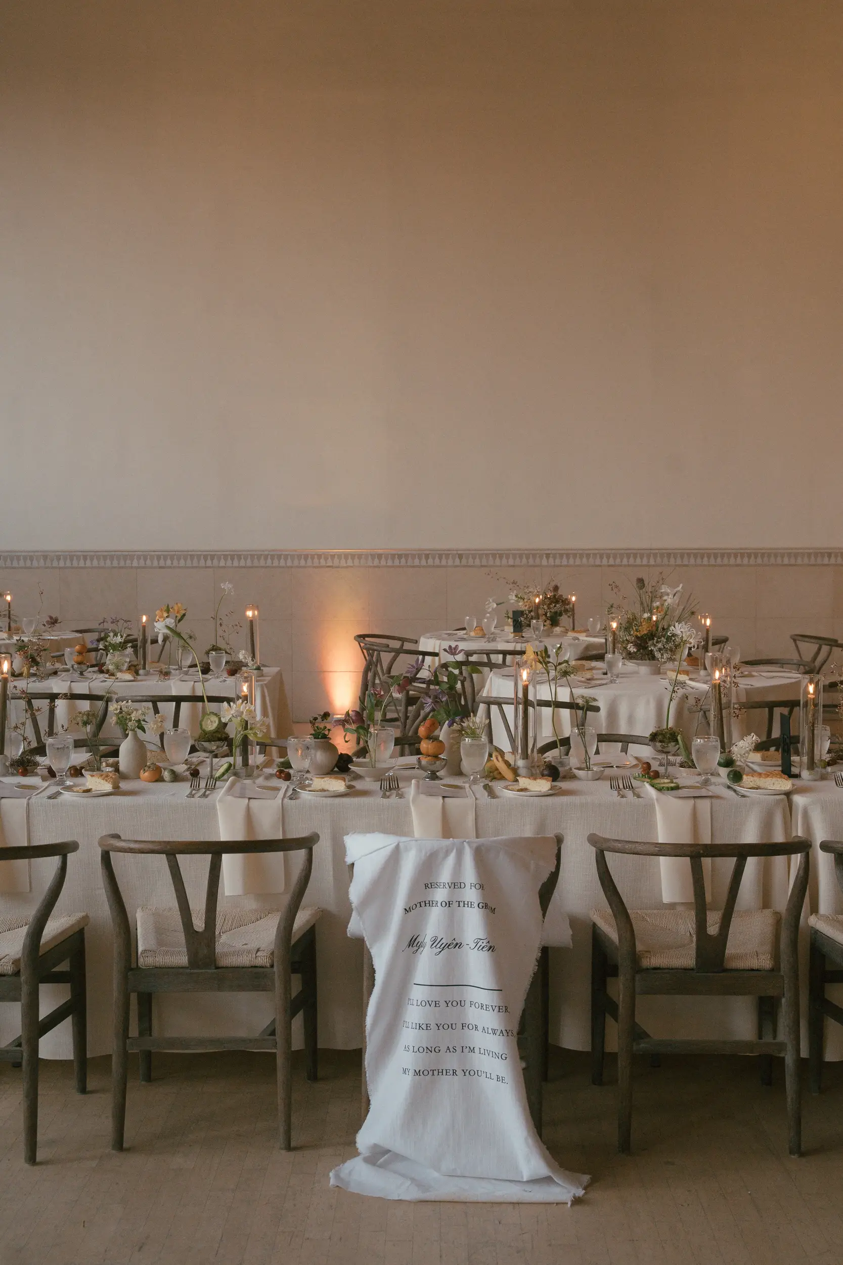 Reception tables with funky fruits and florals.