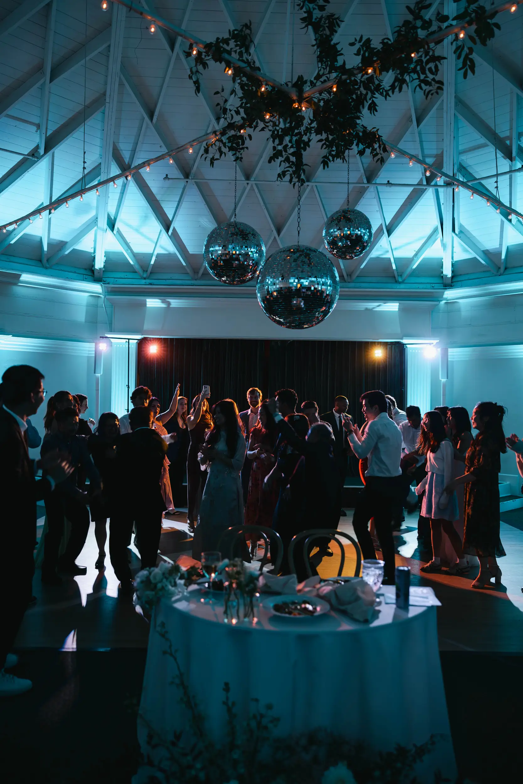 Guests dance under disco balls inside the Casino San Clemente.