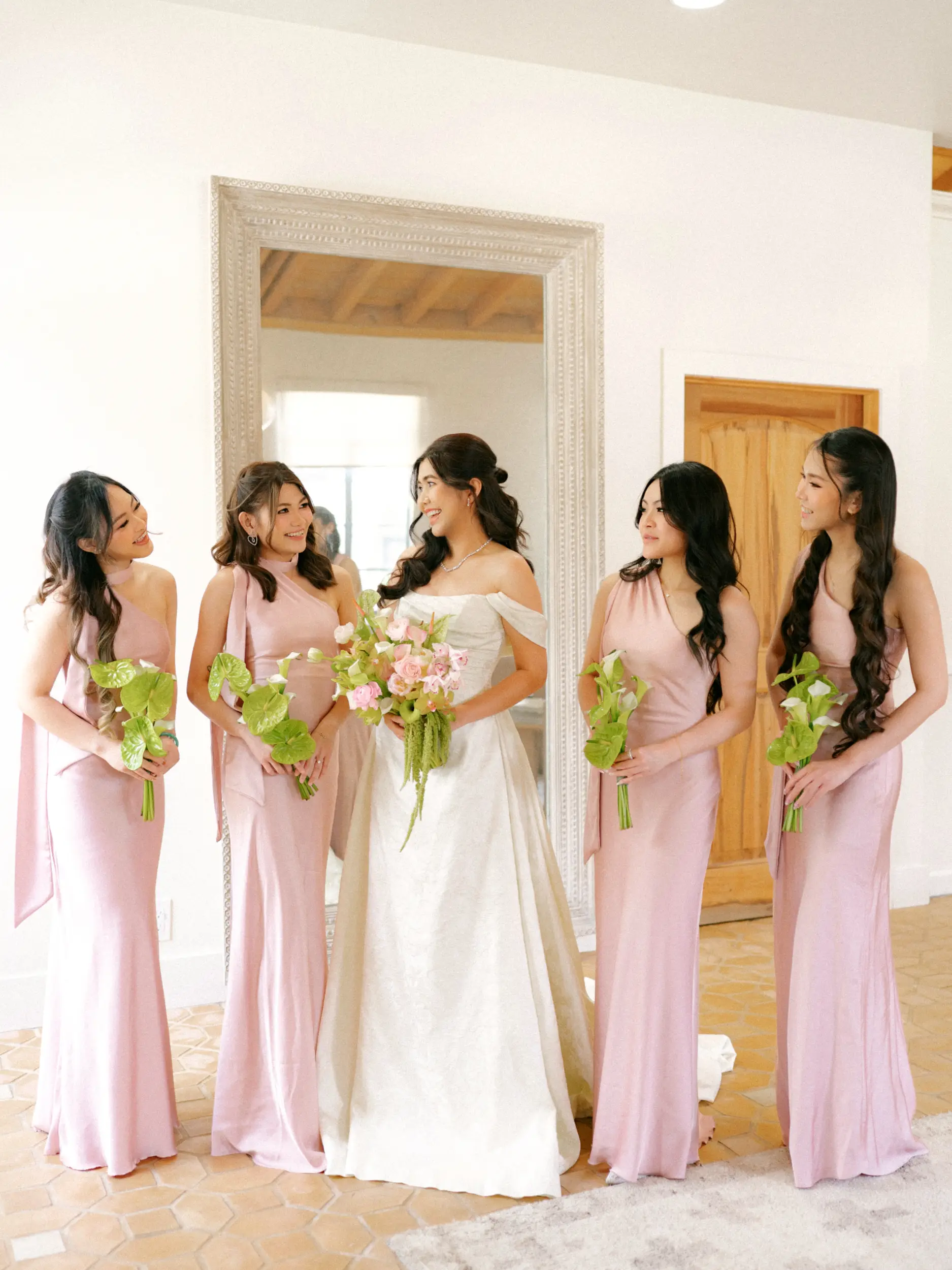 Bride with bridesmaids in the bridal suite.