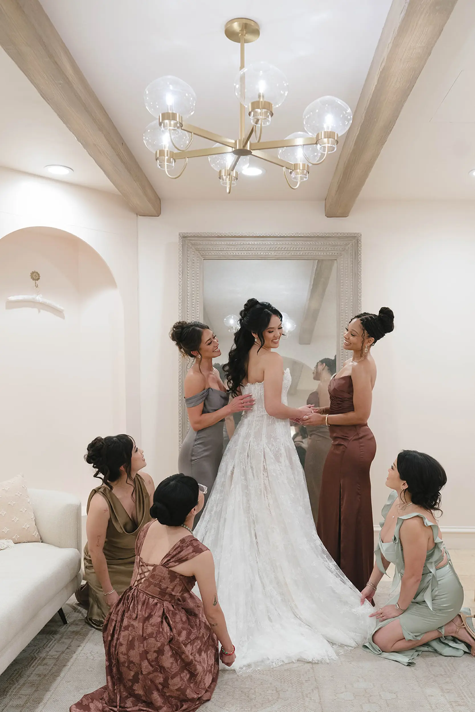 Bride gets ready with bridesmaids inside the Serra Plaza Bridal Suite.