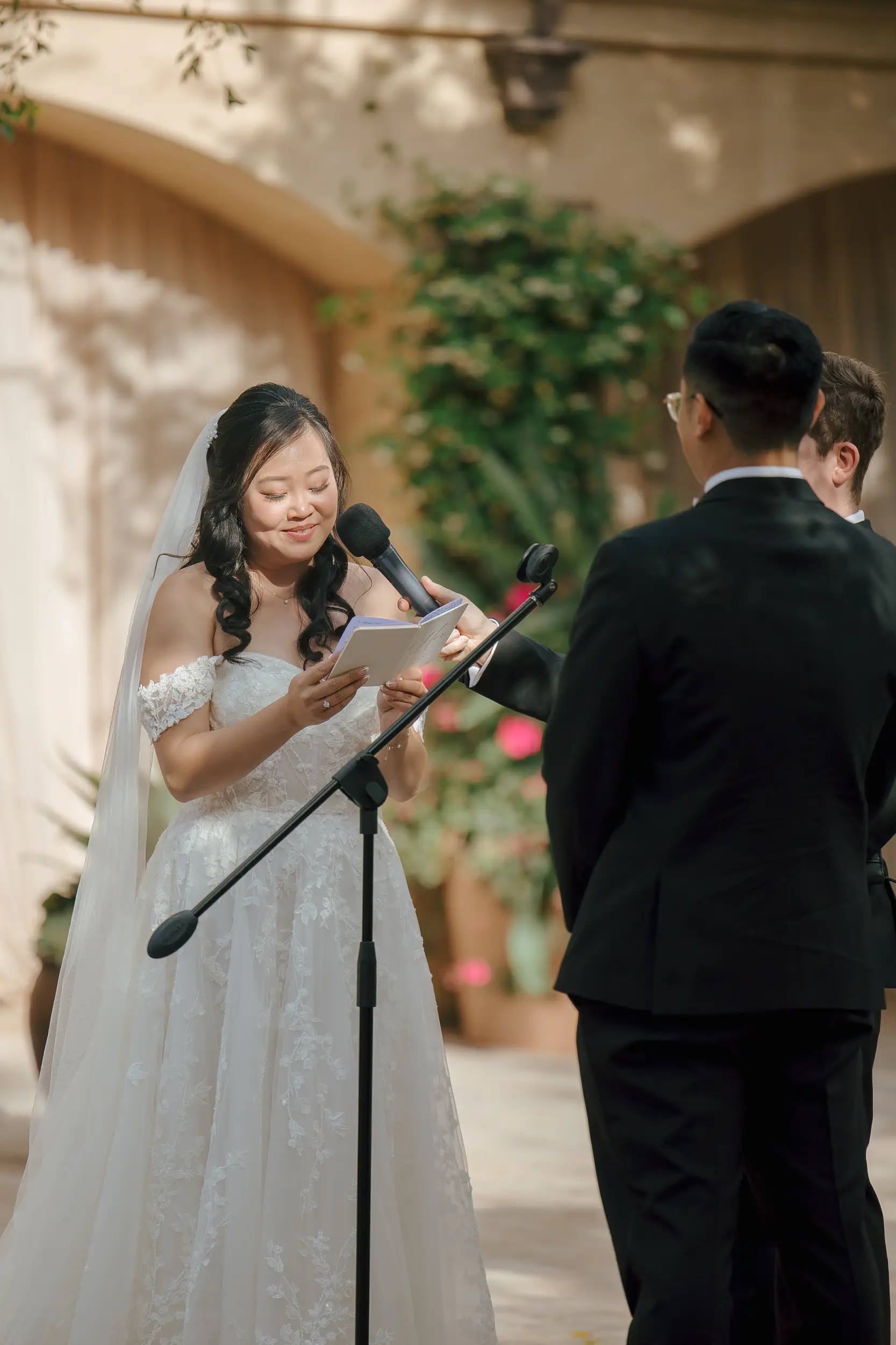 Bride reads wedding vows.