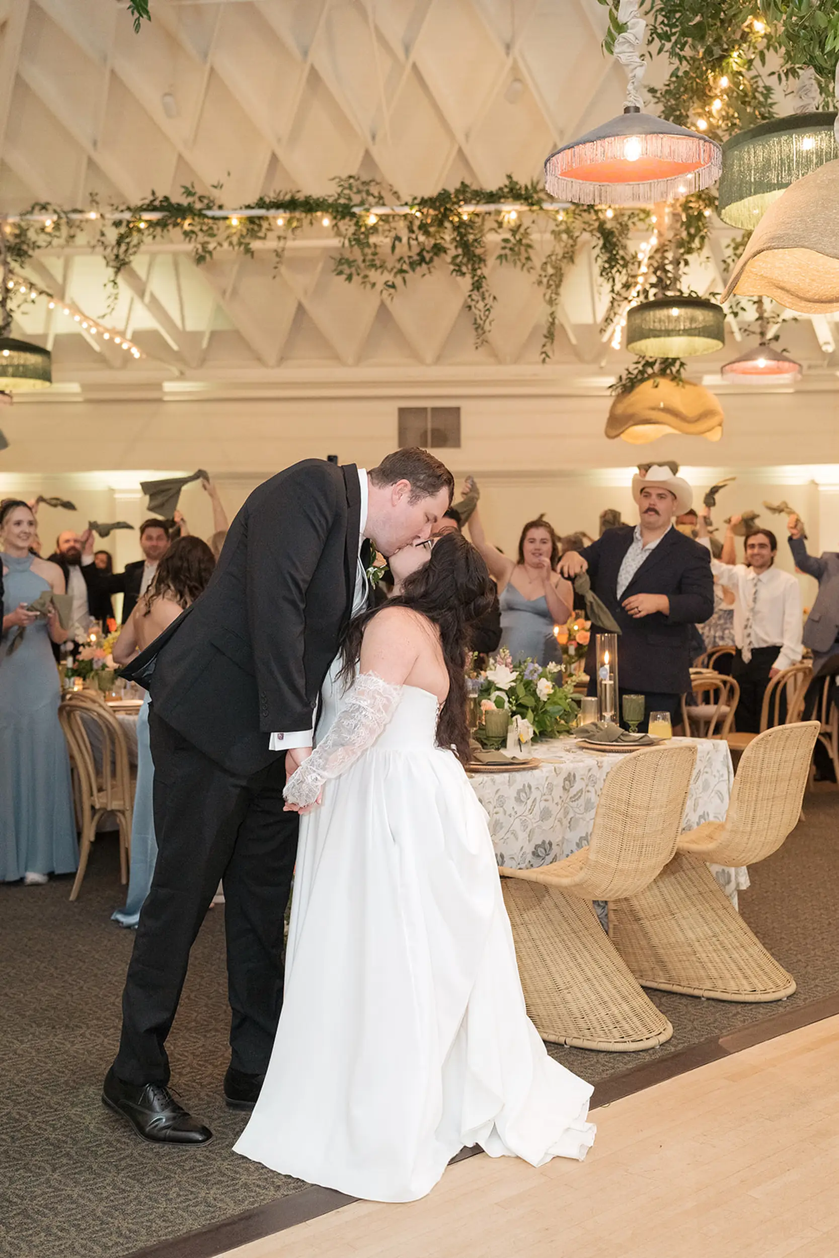 Bride and groom share a kiss inside the Casino San Clemente for their wedding reception.