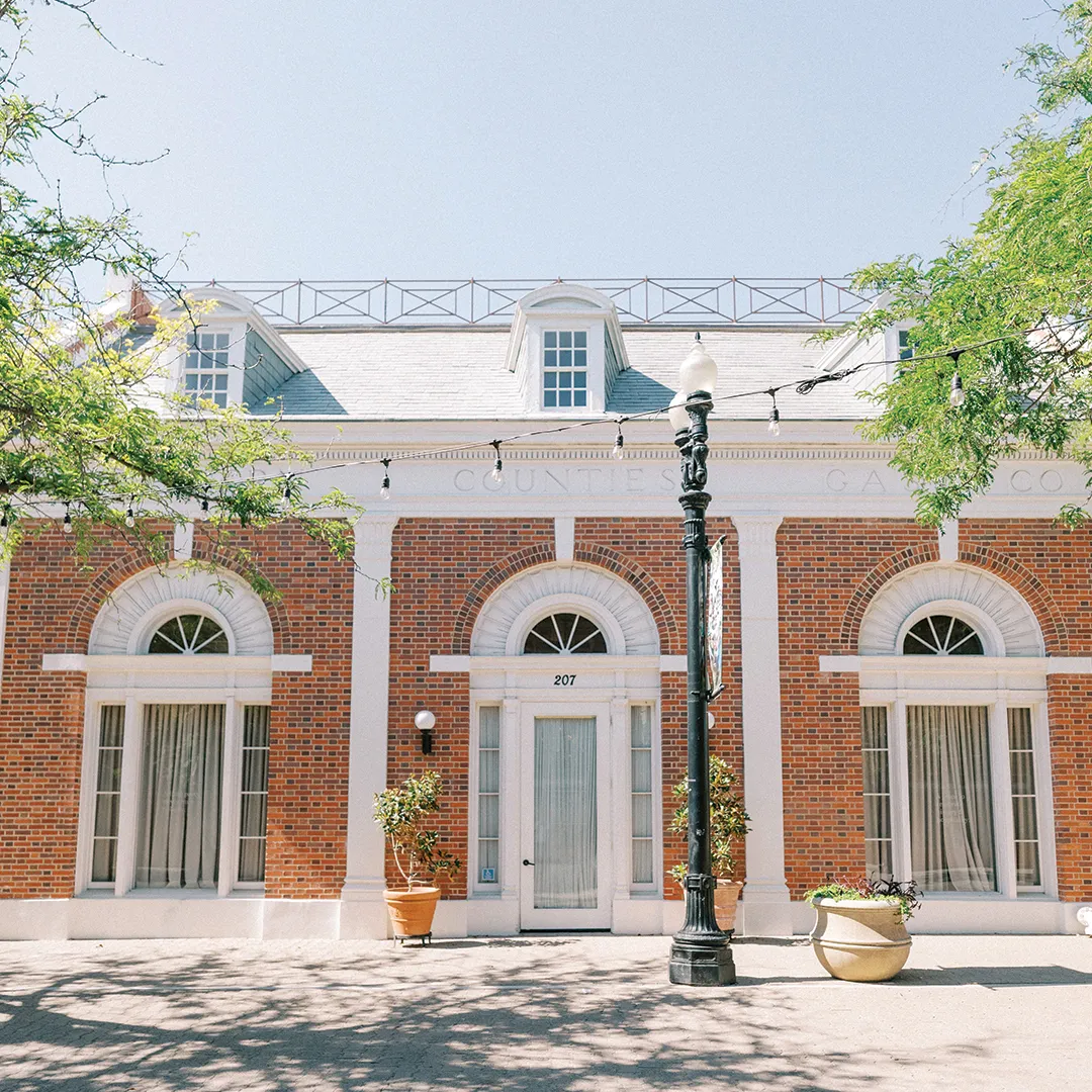 Brick facade and arched windows at The Estate on Second.