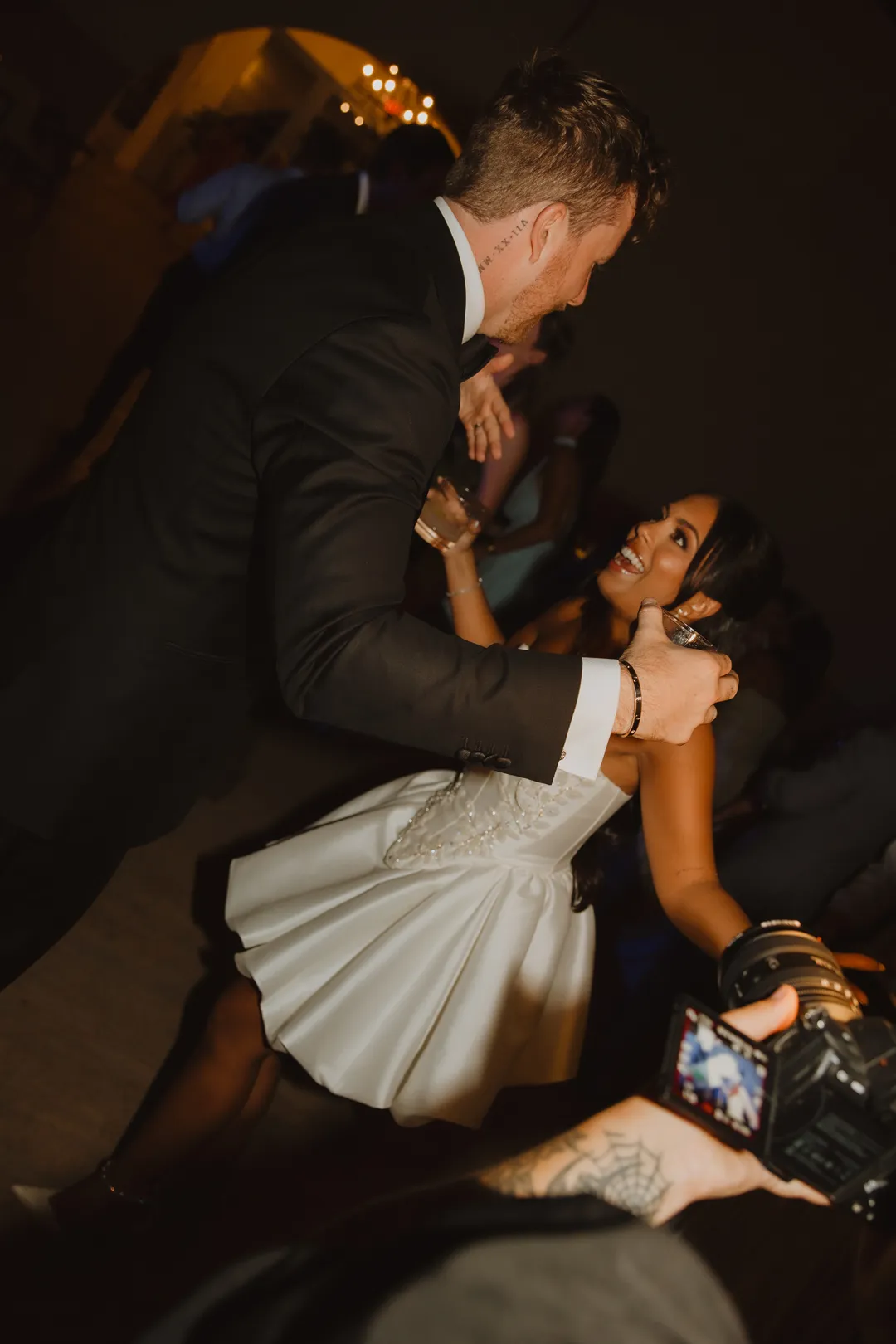 Groom dipping the bride on the dance floor.
