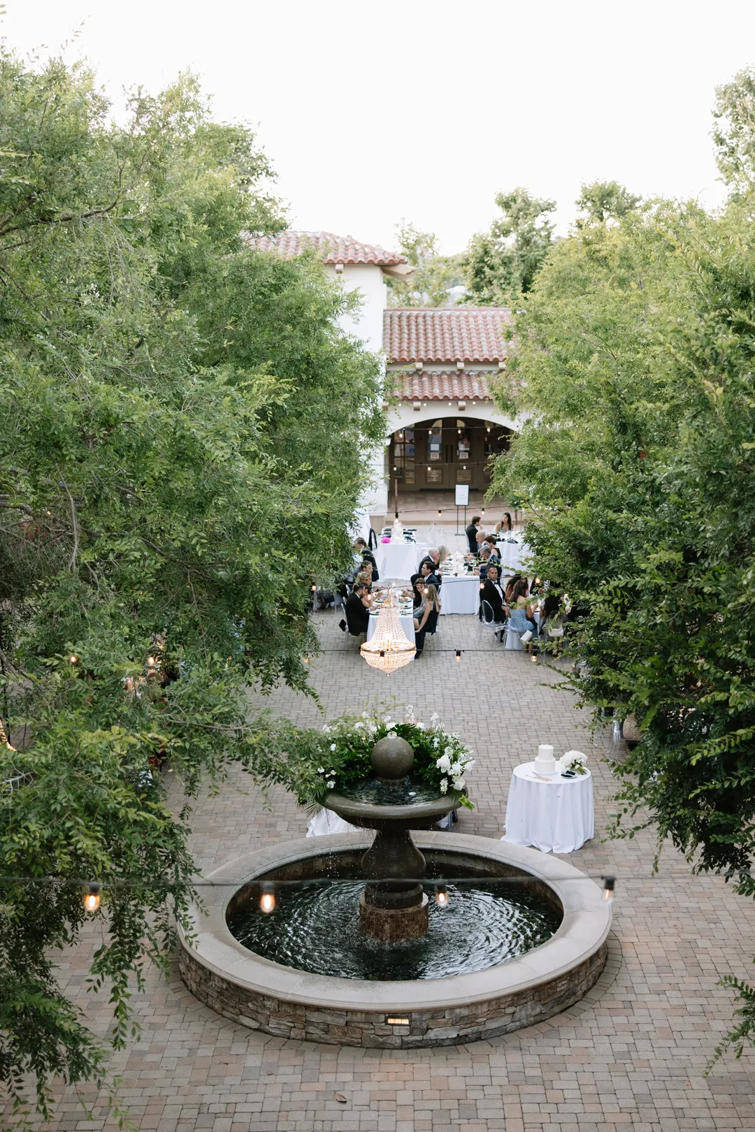 Elevated view of the courtyard fountain and wedding reception.