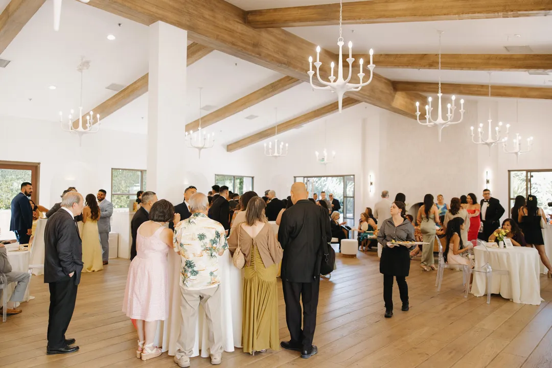 Wedding guests mingling in the lounge.