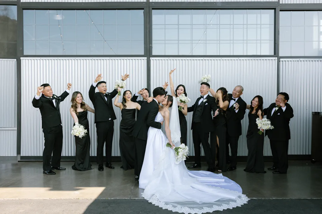 Wedding party cheering in front of the Hangar 21 South doors.