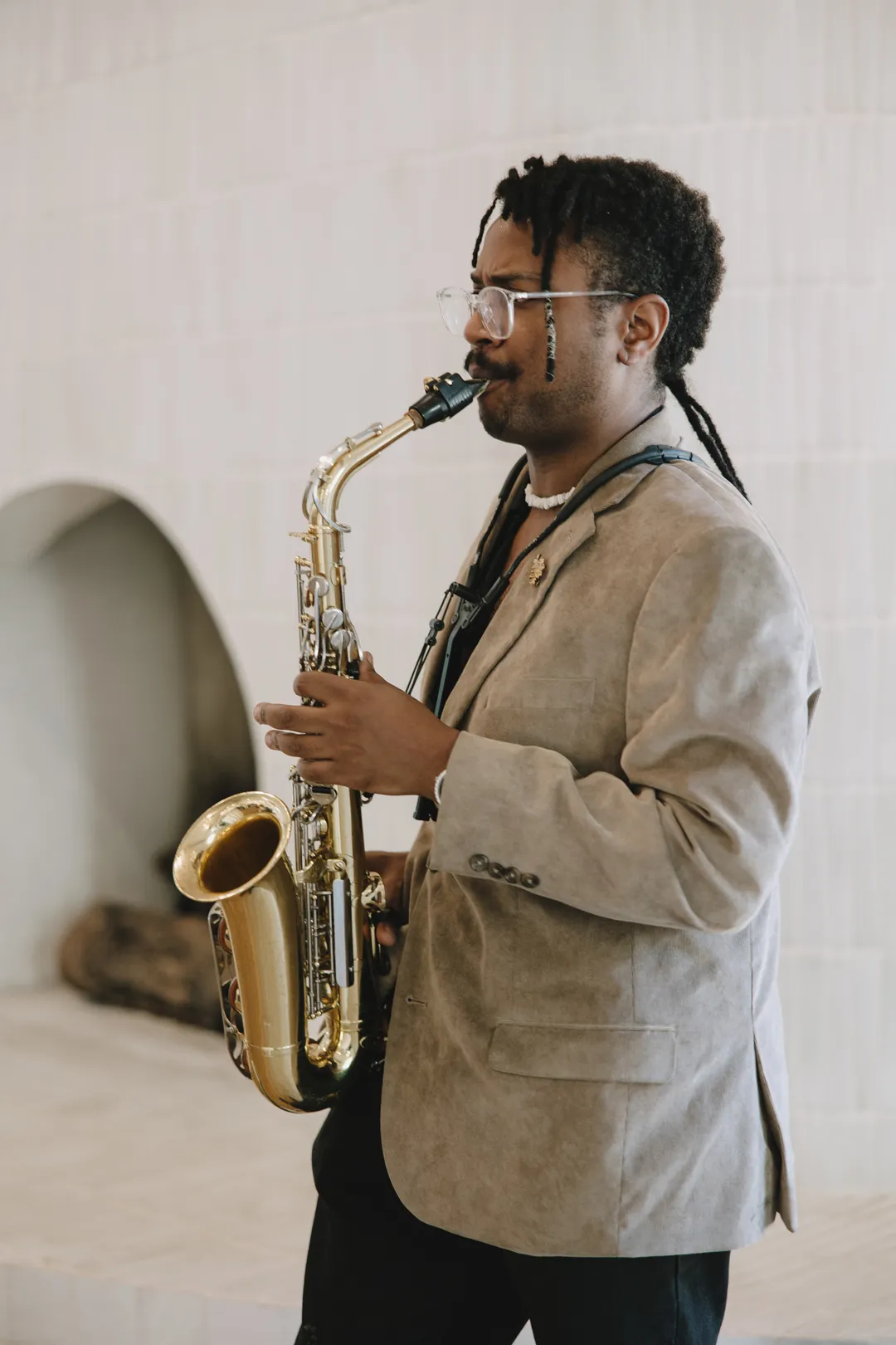 Saxophonist performing in the Serra Plaza lounge.