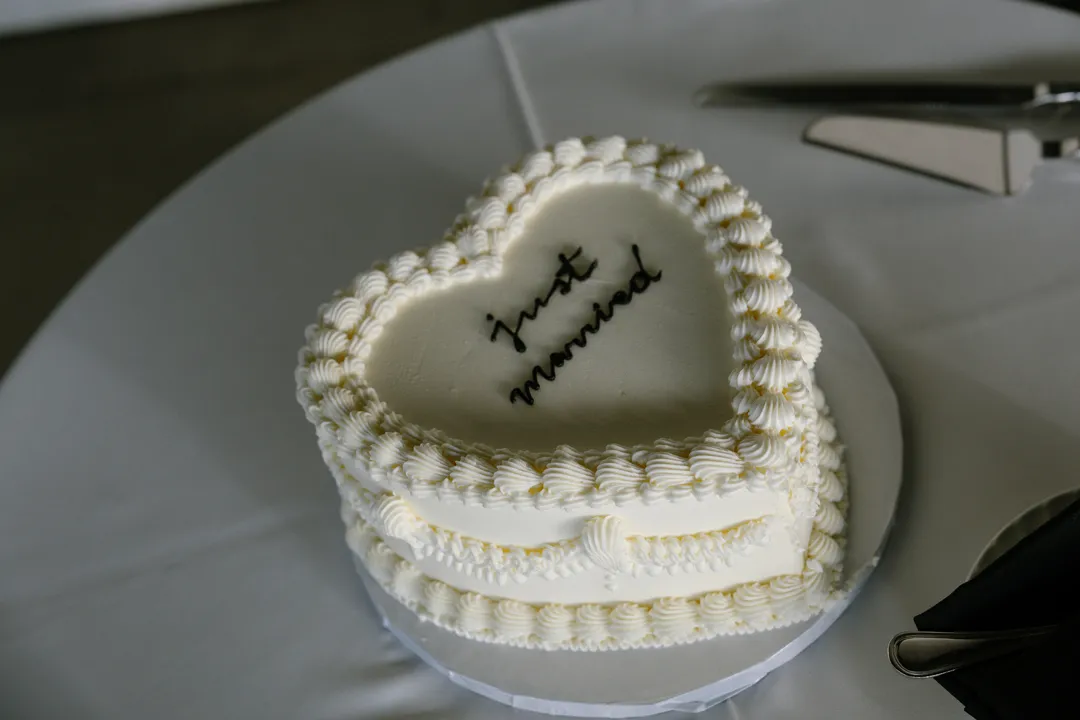 Jay's Catering Vintage Heart Cake with white piping and Just Married lettering.