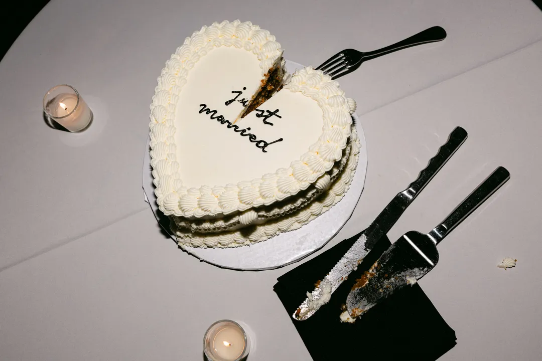 Partially sliced carrot-flavored Vintage Heart Cake from Jay's Catering.