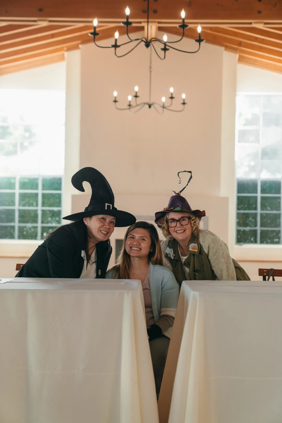 CHOC Guild Con attendees posing in Halloween hats inside Grand Gimeno.