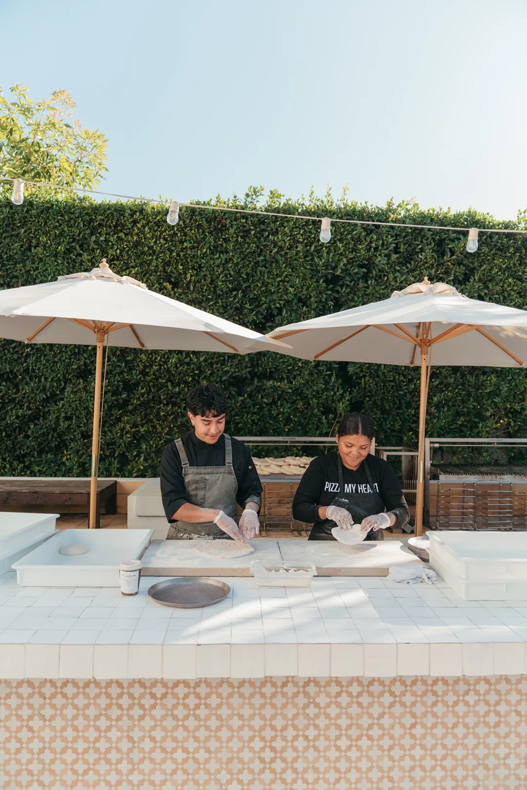 Jay's Catering staff preparing food at Grand Gimeno's outdoor kitchen.