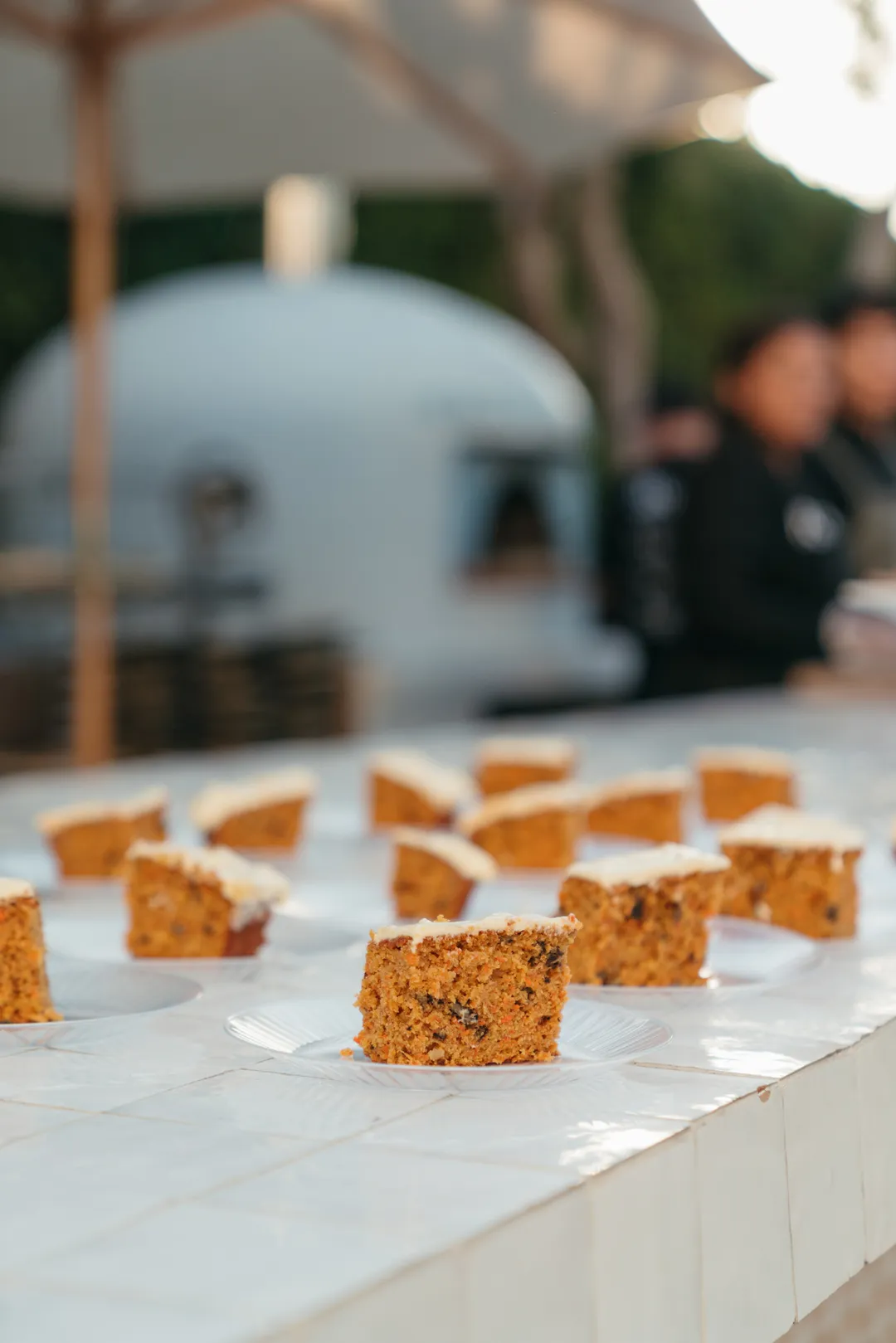 Individual carrot cake squares at the Grand Gimeno CHOC Guild event.