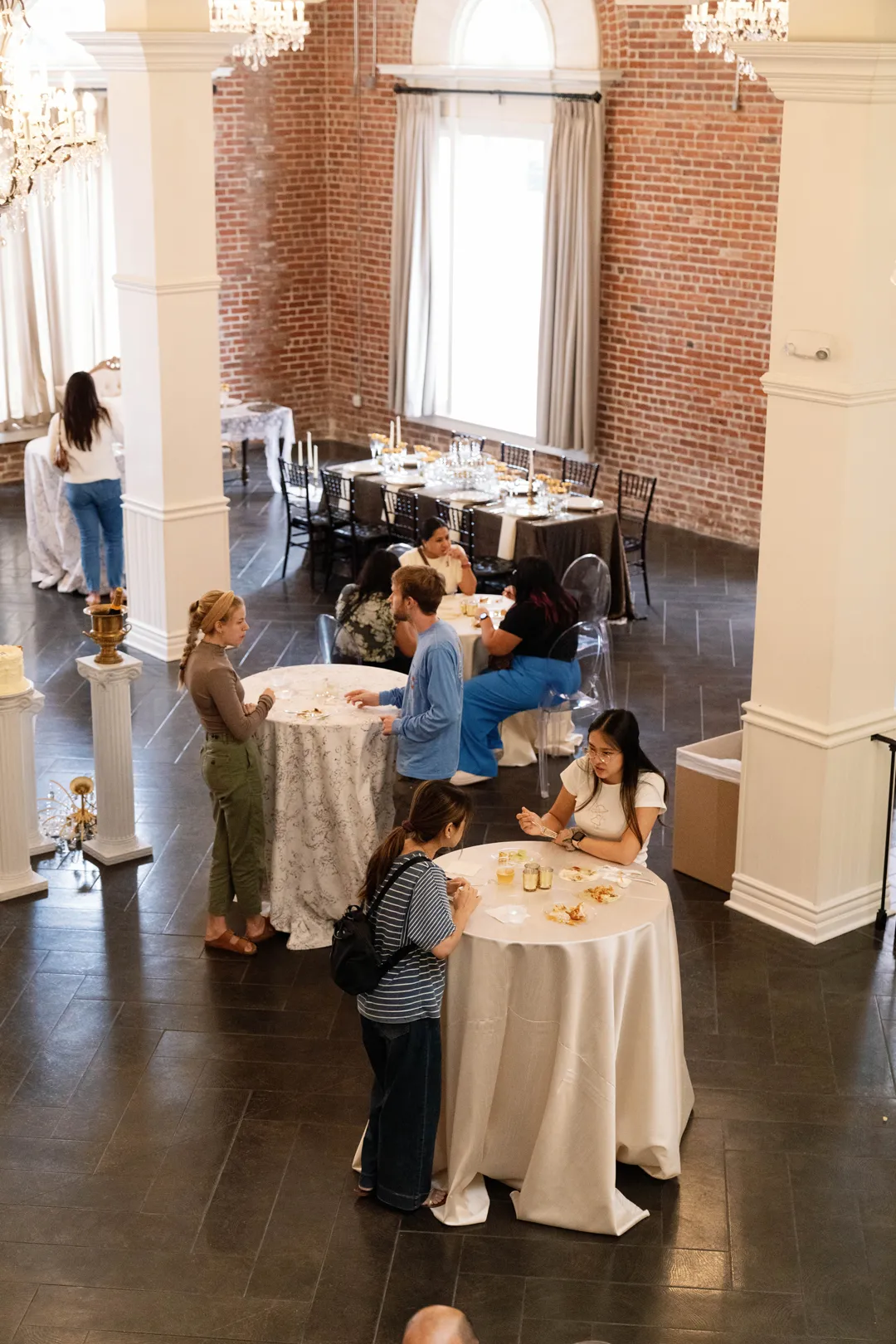 Elevated view of Taste of Jay's guests around cocktail tables at The Estate on Second.