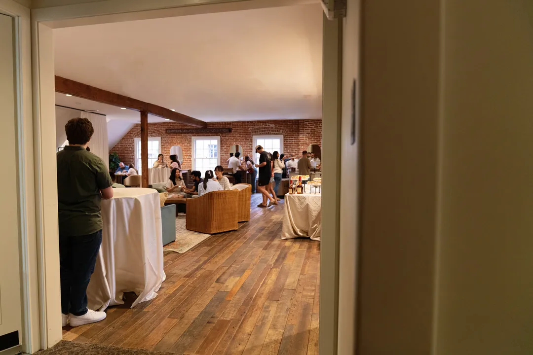 Taste of Jay's guests mingling in The Estate on Second upstairs lounge.