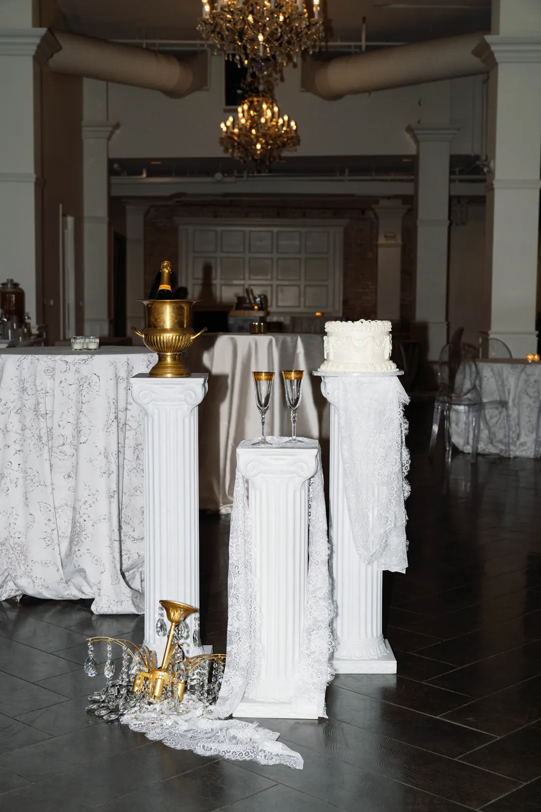 Taste of Jay's cake and bar display on white pedestals at The Estate on Second.