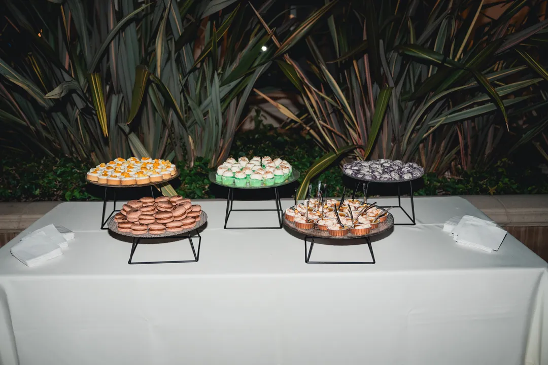 Jay's Catering Taste of Asia Dessert Station with colorful miniature desserts on raised stands.