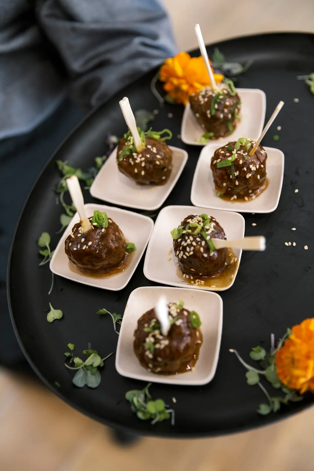 Jay's Catering Thai Lemongrass Meatballs in individual serving spoons.