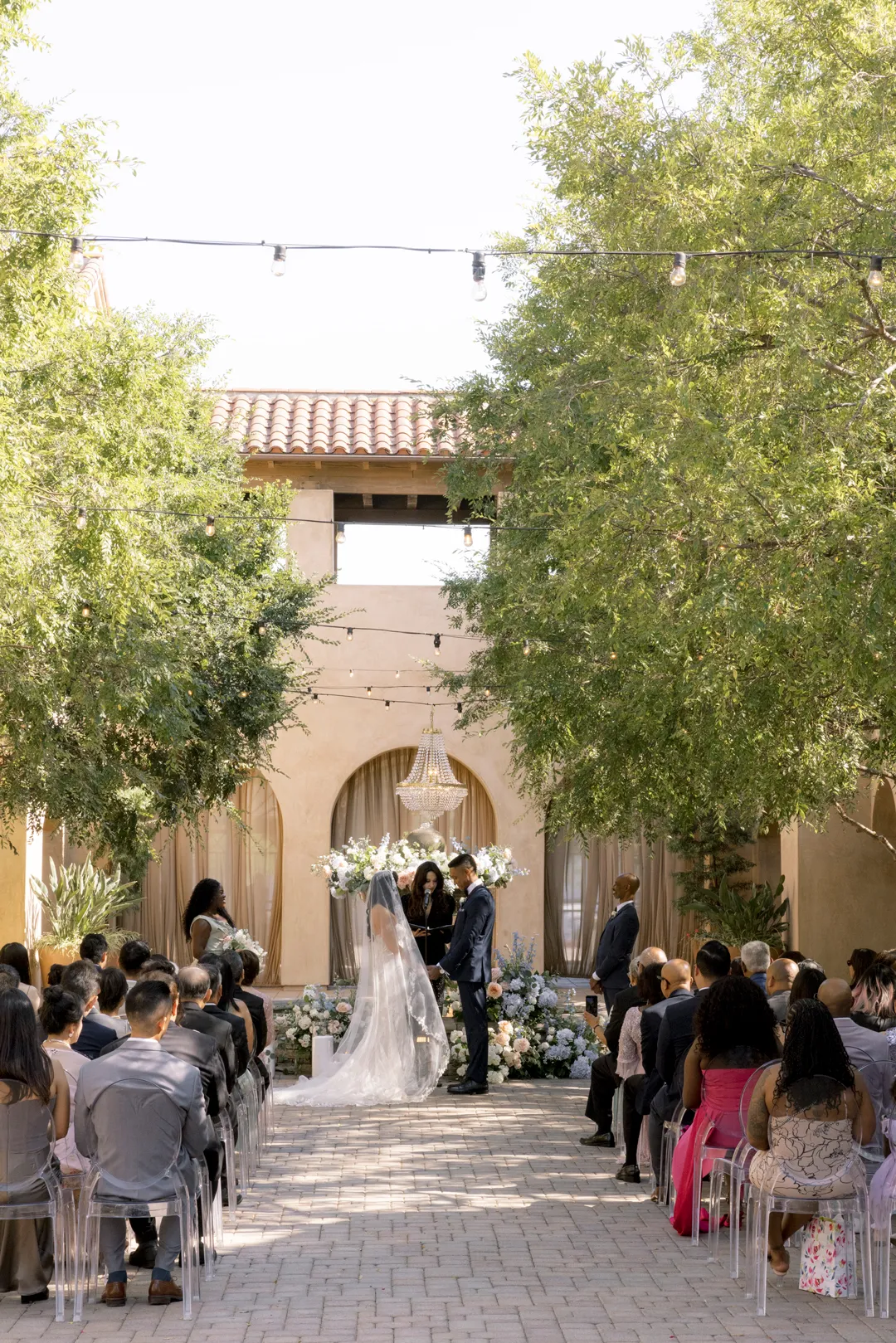 View down the courtyard aisle during the Serra Plaza wedding ceremony.