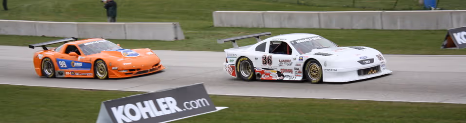 two cars competing during a race