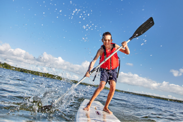Kid paddleboarding