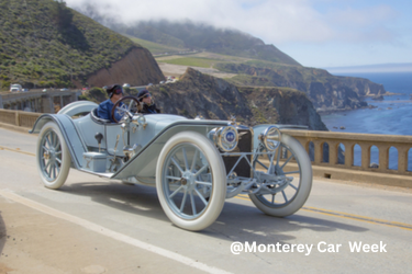 Old school car driving by Bixby Bridge