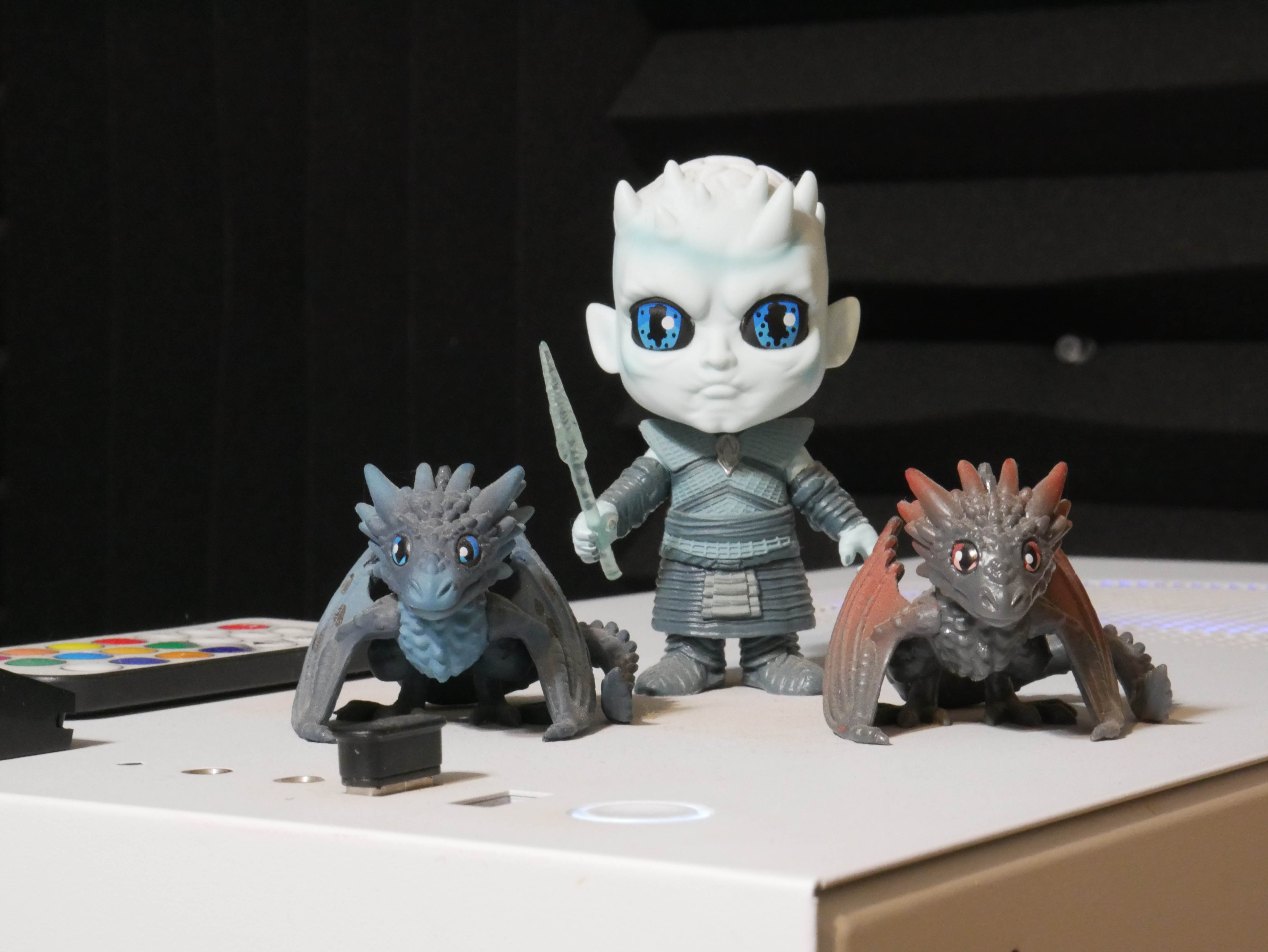 Night King standing next to dragons