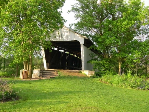 a white covered bridge in pickering ohio