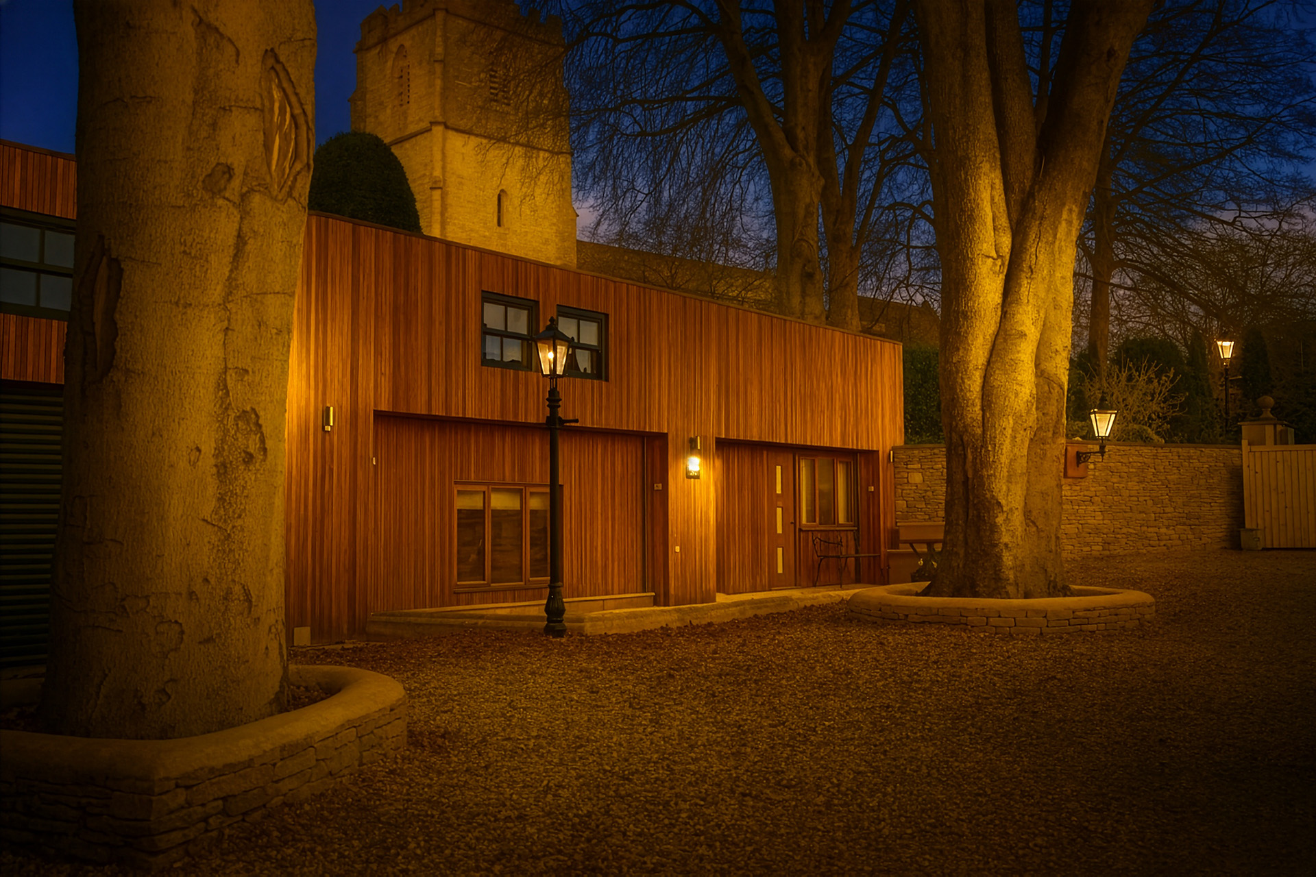 Barn Cottage Painswick - twilight photo with outdoor lights on