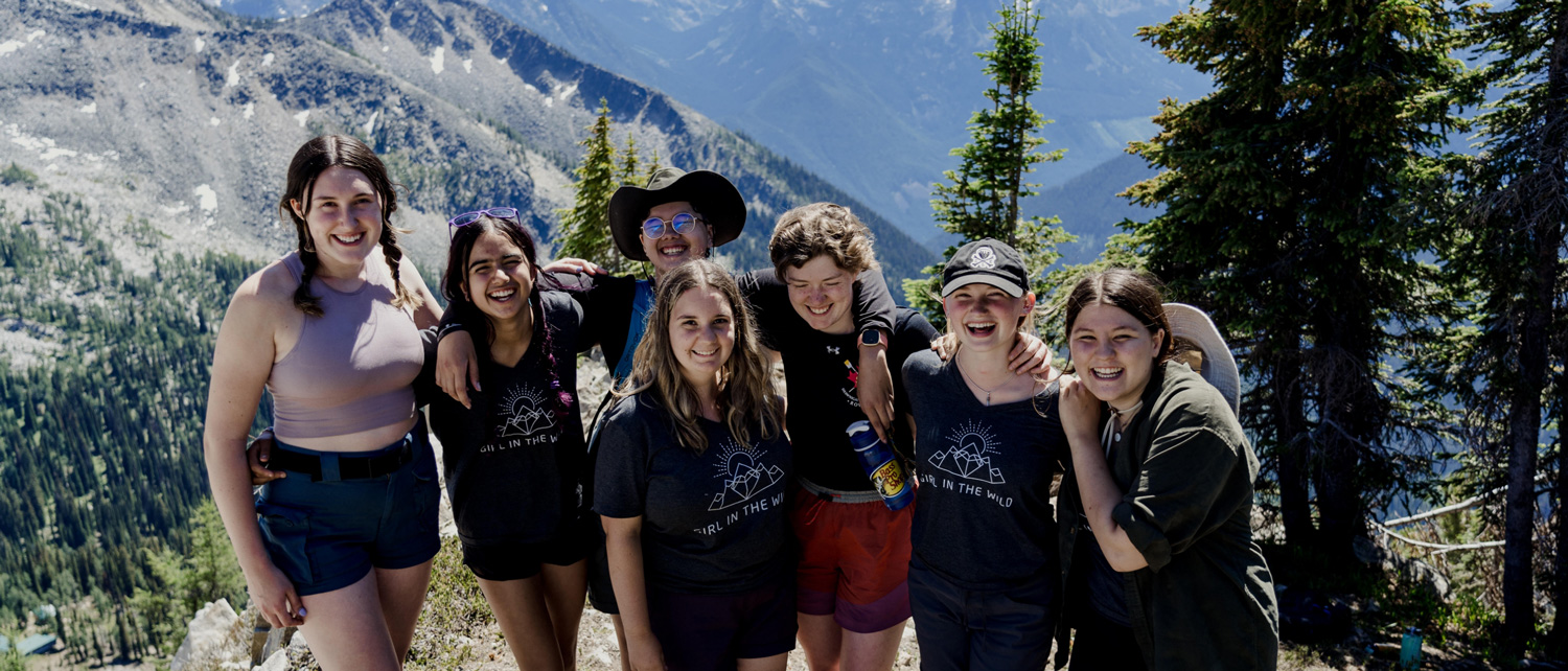 Group photo of Namaste North staff wearing Flipside-designed branded merch in studio lobby