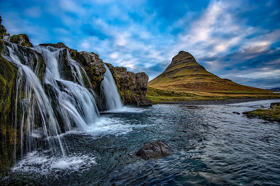 Iceland waterfall with dramatic volcanic landscape