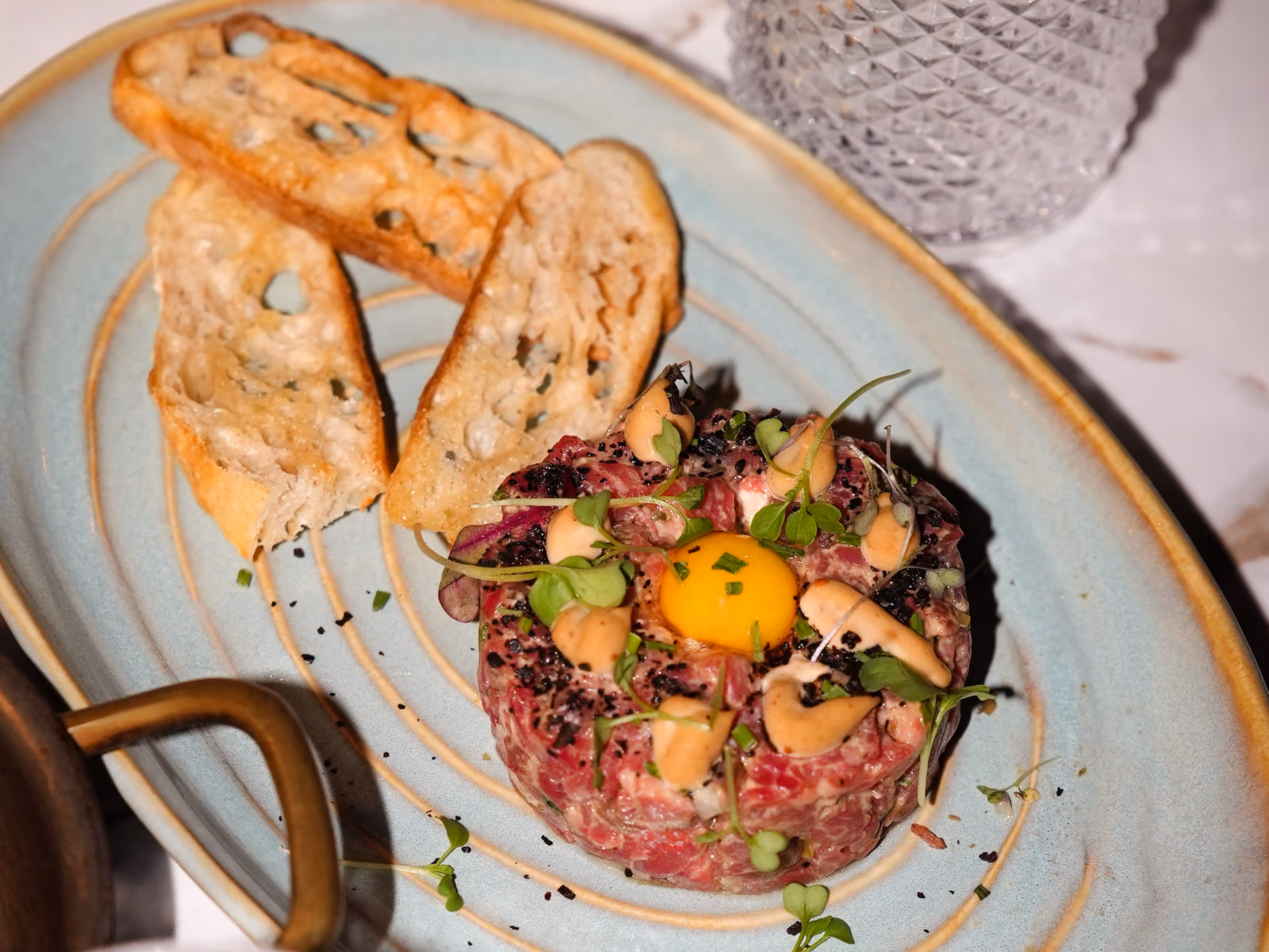 Essex Restaurant New American and Steakhouse Dinner Dishes  feature New Strip Steak, Salmon and Vegan options