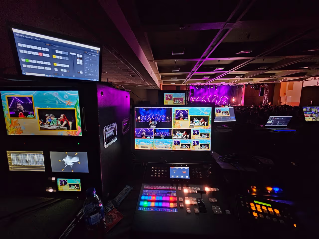 A series of computer screens showing a video multi-view, control panel for video switching, at a live streamed event.