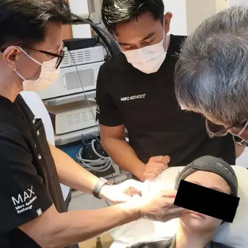 Dr Ivan Puah is seen here demonstrating modern techniques to improve skin quality, including reducing pore size and addressing atrophic acne scars.