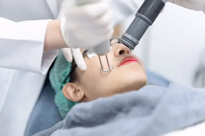 A female patient is receiving another picosecond laser treatment.