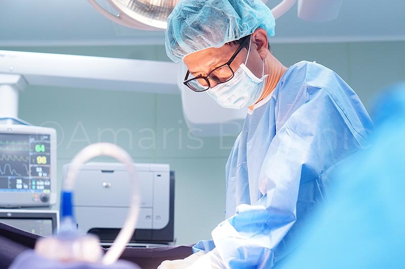 Dr Ivan Puah during a liposuction and fat grafting procedure in an operating theatre in Singapore.