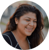 Young Hispanic woman with long brown hair smiling