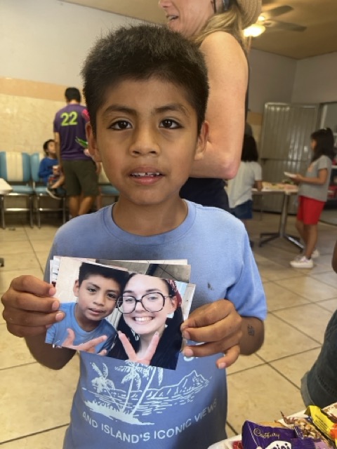 Child holding a printed photo