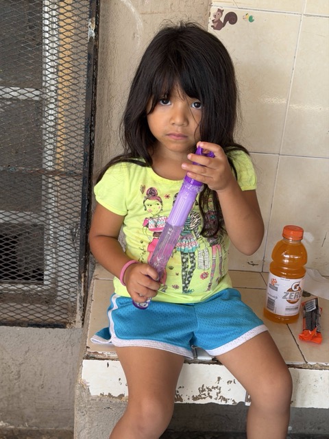Child at a community gathering