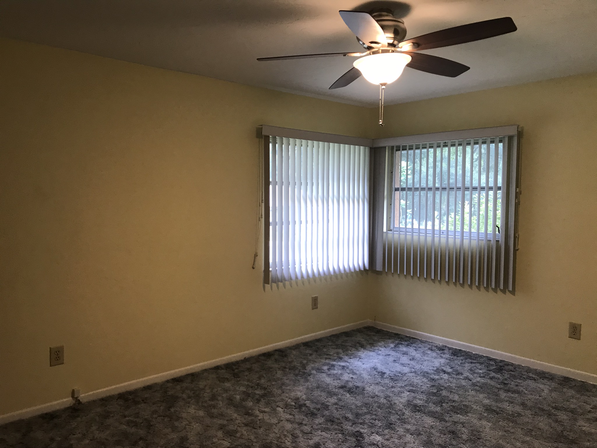 Bedroom one with carpet floors